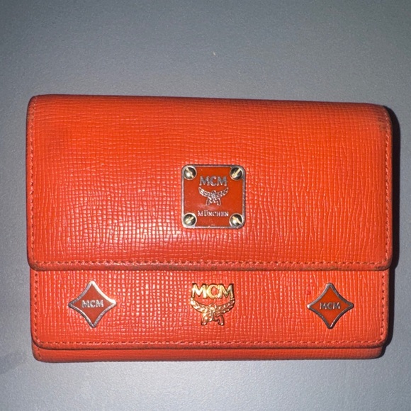 MCM Handbags - MCM Orange Leather Trifold Wallet with Gold Logo Accents
